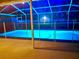 Sparkling pool enclosed by a screen and safety fence, perfect for relaxing evenings at 11268 Shivering Owl Ave, Weeki Wachee, FL 34614