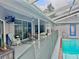 The patio area offers seamless transition from the outdoor pool area with comfortable seating and stylish design at 11268 Shivering Owl Ave, Weeki Wachee, FL 34614