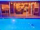 Inviting pool with clear blue water, safety fence and backyard views at 11268 Shivering Owl Ave, Weeki Wachee, FL 34614