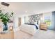 Stylish primary bedroom featuring a neutral color palette and ample natural light at 12440 Gust Ct, Hudson, FL 34669