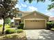 Charming two-story home with a two-car garage and well-maintained landscaping at 12604 Montford Ln, Riverview, FL 33579
