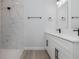 Elegant bathroom showcasing a tiled shower and double sink vanity for a spa-like experience at 13451 Kaplan Ter, Port Charlotte, FL 33981