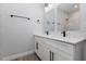 Modern bathroom featuring double sinks, quartz countertops, and stylish black hardware at 13451 Kaplan Ter, Port Charlotte, FL 33981