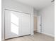 A bedroom with a closet and light gray flooring at 13451 Kaplan Ter, Port Charlotte, FL 33981