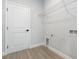 Interior laundry room with wire shelving, grey walls and white trim at 13451 Kaplan Ter, Port Charlotte, FL 33981