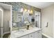 Beautiful bathroom with granite double vanity, stylish mirror, and modern fixtures at 1422 Pinebrook Dr, Clearwater, FL 33755