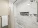 Elegant bathroom with white tiled shower and niche at 1422 Pinebrook Dr, Clearwater, FL 33755