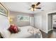 Comfortable bedroom featuring a ceiling fan, closet and view from the window at 1422 Pinebrook Dr, Clearwater, FL 33755