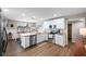 Open concept kitchen with stainless steel appliances, granite countertops, and a dining area at 1422 Pinebrook Dr, Clearwater, FL 33755