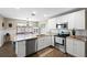 Well-designed kitchen featuring stainless steel appliances, granite countertops, and white cabinetry at 1422 Pinebrook Dr, Clearwater, FL 33755
