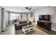 Comfortable living room with stylish decor, a cozy couch, and a view into the dining area at 1422 Pinebrook Dr, Clearwater, FL 33755