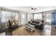 Cozy living room with natural light, comfortable seating, and stylish decor creating a welcoming atmosphere at 1422 Pinebrook Dr, Clearwater, FL 33755
