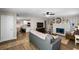 Open-concept living area with a fireplace, seamlessly connecting to the modern kitchen and dining space at 1422 Pinebrook Dr, Clearwater, FL 33755