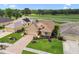 Aerial view of a well-maintained home with manicured lawn, landscaping, and patterned driveway at 17425 Eagle Trace Dr, Brooksville, FL 34604