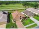 A lovely home in a desirable neighborhood featuring a manicured lawn and overlooking the lush green golf course at 17425 Eagle Trace Dr, Brooksville, FL 34604