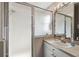 Bathroom featuring frosted glass shower, modern fixtures, and functional design perfect for relaxing at 17425 Eagle Trace Dr, Brooksville, FL 34604