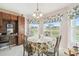 Charming breakfast nook with a table for four and views of the outdoors with golf course at 17425 Eagle Trace Dr, Brooksville, FL 34604