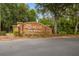 Rivard neighborhood entrance sign is brick with decorative lettering and lush landscaping at 17425 Eagle Trace Dr, Brooksville, FL 34604