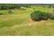 Expansive aerial view of a golf course featuring lush green fairways and mature trees at 17425 Eagle Trace Dr, Brooksville, FL 34604