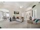 Open-concept living and dining area with neutral carpet and lots of natural light at 17425 Eagle Trace Dr, Brooksville, FL 34604