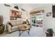 Cozy living room with neutral carpet, comfortable seating, and a sliding glass door at 17425 Eagle Trace Dr, Brooksville, FL 34604