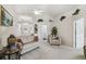 Comfortable living room with neutral carpet, vaulted ceilings, and lots of natural light at 17425 Eagle Trace Dr, Brooksville, FL 34604