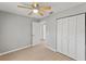 Neutral bedroom featuring light wood floors, a ceiling fan, and closet at 1843 38Th S St, St Petersburg, FL 33711