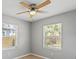 Bright bedroom with ceiling fan features two windows providing natural light at 1843 38Th S St, St Petersburg, FL 33711