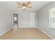 Spacious living room featuring light-toned floors, neutral walls, and natural light from the windows at 1843 38Th S St, St Petersburg, FL 33711