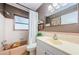 Traditional bathroom featuring a shower-tub combination and a single sink vanity at 1942 Ashland Dr, Clearwater, FL 33763