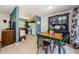 Charming dining area featuring vintage furniture and views of the adjacent kitchen at 1942 Ashland Dr, Clearwater, FL 33763