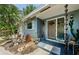 Charming front entrance with a well-manicured garden, updated front door, and decorative rain chains at 1942 Ashland Dr, Clearwater, FL 33763