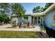 Home exterior with well-maintained landscaping, updated siding, creating great curb appeal at 1942 Ashland Dr, Clearwater, FL 33763