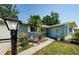 Charming single-story home featuring a well-maintained lawn and mature landscaping at 1942 Ashland Dr, Clearwater, FL 33763