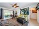 Inviting living area features an open plan and access to a covered, screened patio at 1942 Ashland Dr, Clearwater, FL 33763