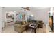 Open-concept living room featuring tile floors, a ceiling fan, and neutral paint at 2001 Hudson Ct, Oldsmar, FL 34677