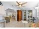 Inviting open-plan living space with tile floors, lots of space and natural light, ceiling fan at 2001 Hudson Ct, Oldsmar, FL 34677