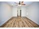Bedroom features wood-look floors and access to a bathroom and closet at 2004 Chickwood Ct, Tampa, FL 33618