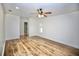 Spacious bedroom features wood-look floors and a ceiling fan for added comfort at 2004 Chickwood Ct, Tampa, FL 33618