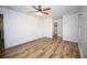 Bedroom features wood-look floors and a connecting bathroom and closet at 2004 Chickwood Ct, Tampa, FL 33618