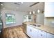 Bright kitchen featuring stainless appliances, granite countertops, and view of pool at 2004 Chickwood Ct, Tampa, FL 33618