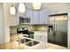 The updated kitchen showcases stainless appliances and granite countertops at 2004 Chickwood Ct, Tampa, FL 33618