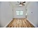 Open living room with wood-look flooring and natural light showcases spaciousness at 2004 Chickwood Ct, Tampa, FL 33618
