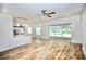Bright open floor plan with wood-look floors, bar seating and access to lanai at 2004 Chickwood Ct, Tampa, FL 33618