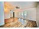 Large living room featuring wood-look floors and ample natural light offers space and charm at 2004 Chickwood Ct, Tampa, FL 33618