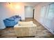 Bright living room showcases wood-look floors and modern furniture at 2004 Chickwood Ct, Tampa, FL 33618