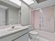 Cozy bathroom featuring a shower with sliding glass doors, and a classic single sink vanity at 2023 Golfview Dr # 2023, Tarpon Springs, FL 34689