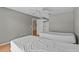 Bright bedroom features wood floors and convenient access to the bathroom and closet areas at 2023 Golfview Dr # 2023, Tarpon Springs, FL 34689