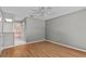 Spacious bedroom featuring wood floors and ensuite bathroom perfect for creating a relaxing retreat at 2023 Golfview Dr # 2023, Tarpon Springs, FL 34689