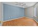 Comfortable bedroom with a ceiling fan, wood floors, and a serene atmosphere that is perfect for relaxation at 2023 Golfview Dr # 2023, Tarpon Springs, FL 34689